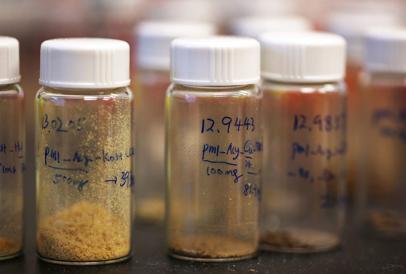 Neumina botanical extract vials with lab labels - evidence-based nutrition and clinical formulations